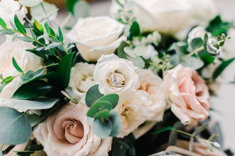 White roses with a wedding ring
